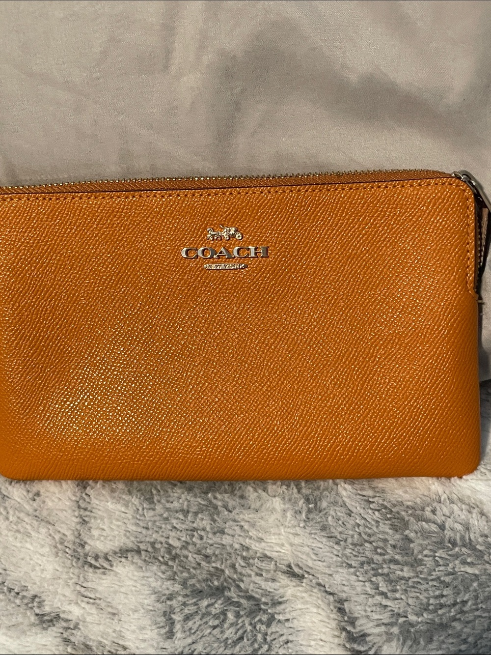 COACH Pebbled Leather Zip Wristlet in Orange